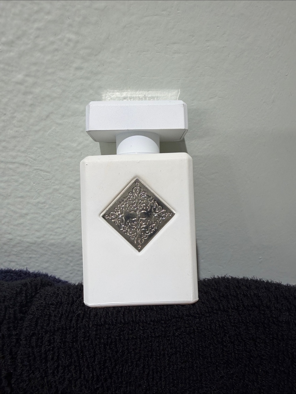 White Decorative Ceramic Accent Bottle with Ornate Silver Medallion